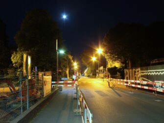 Biel, Switzerland - Mai 31, 2023: seasonal urban landscape with street lamps and trees at night